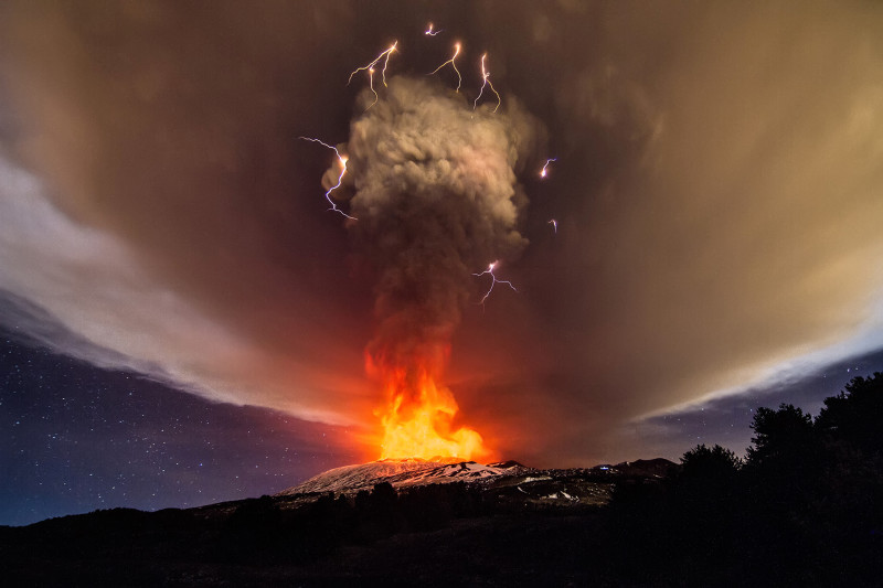 03 Dec 2015, Catania, Catania Province, Sicily, Italy, Italy --- Catania, Italy. 3rd December 2015 -- A so-called dirty thunderstorm with volcanic lightning seen as Mount Etna erupts. The weather phenomenon is related to the production of lightning in a volcanic plume. The image was captured by merging five separate images in sequence. -- Explosions and ash emissions were seen from Mount Etna's Voragine crater. The Voragine was formed inside the volcano's central crater in 1945. Its last eruptive activity dates back to 2013. --- Image by © Marco Restivo/Demotix/Corbis